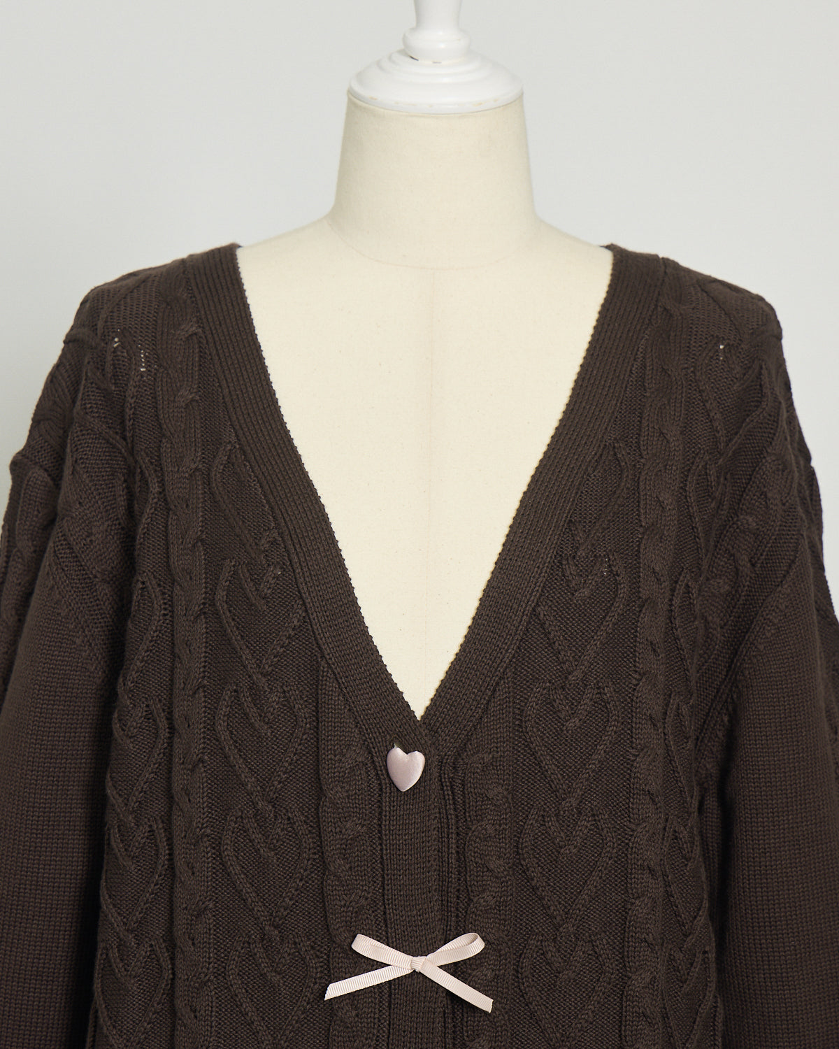 ハートボタンケーブルロングカーデ