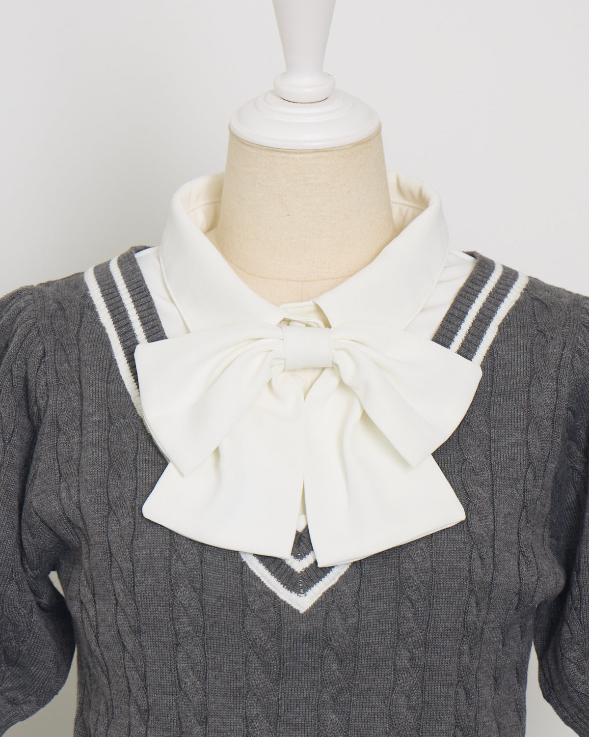 リボンタイ付きレイヤードケーブルニット