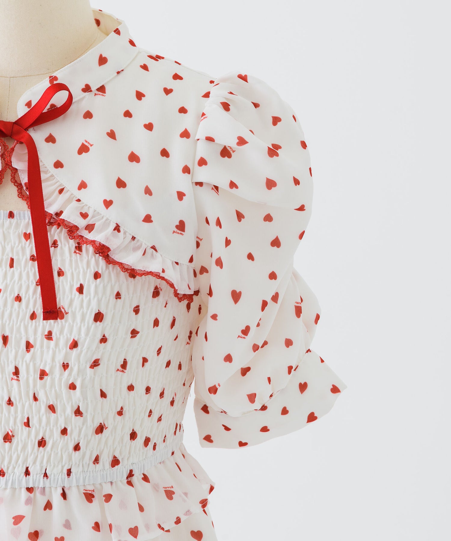 piumハートシャーリングケープワンピース